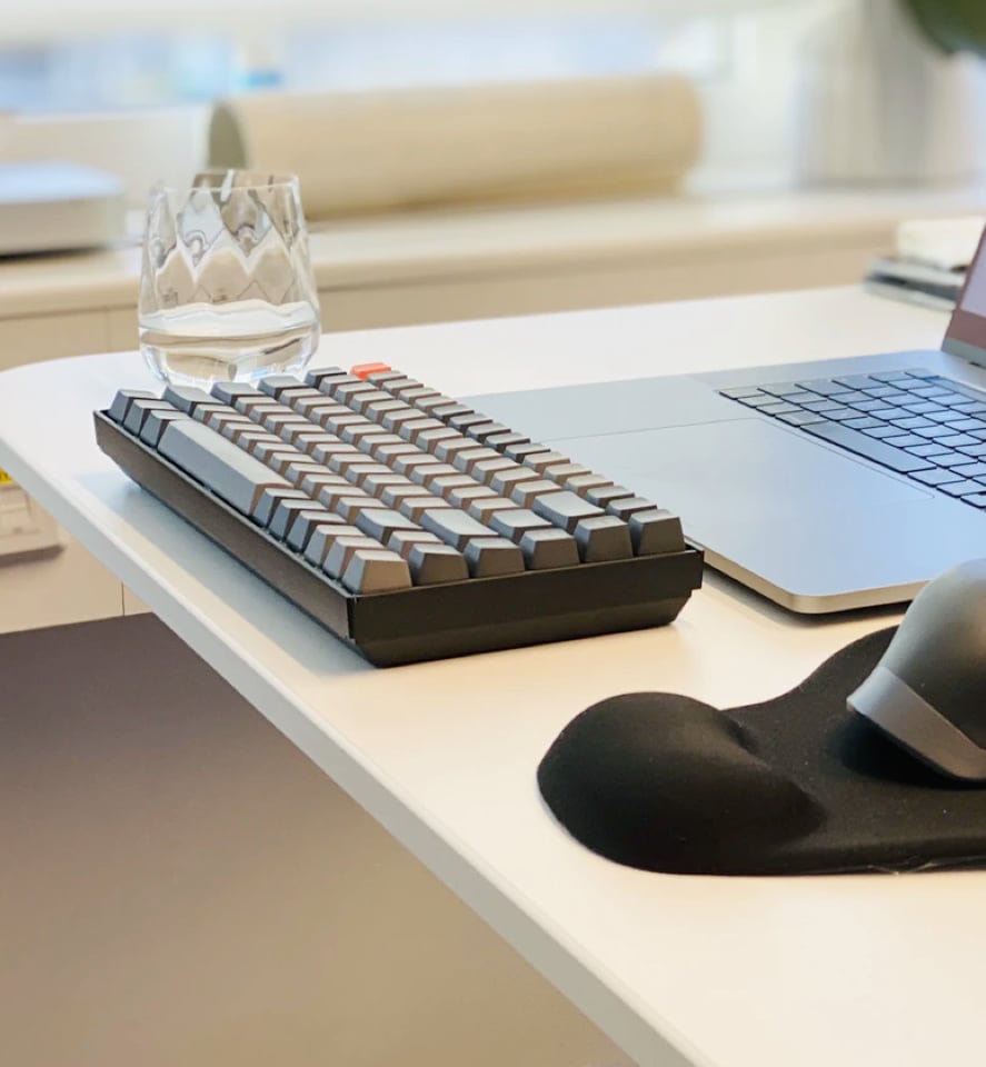 Keyboard and glass of water