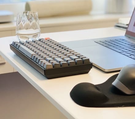 Keyboard and glass of water