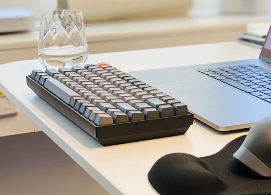 Keyboard and glass of water